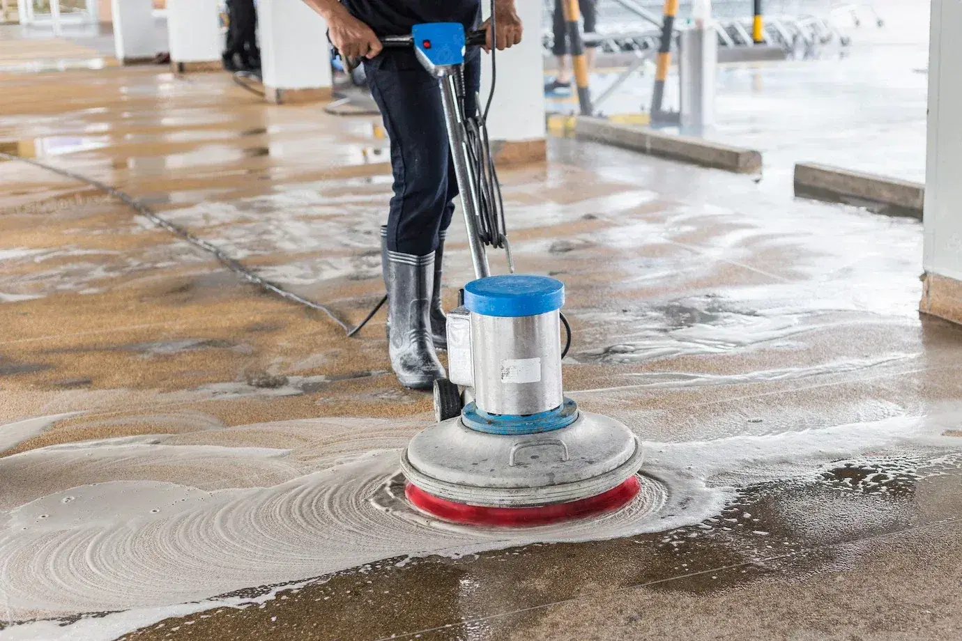 Industrial floor cleaning with power scrubber