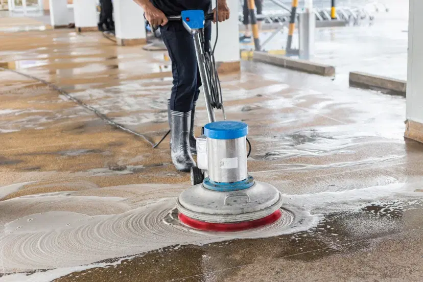 Industrial floor cleaning with power scrubber