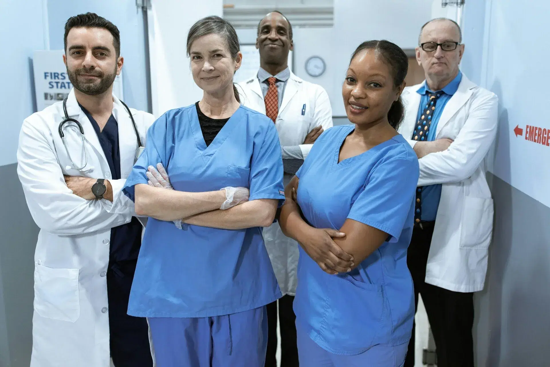 A tidy home office desk with a laptop, notebook, and no visible clutter