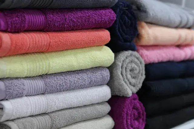 Stack of clean, folded white bath towels