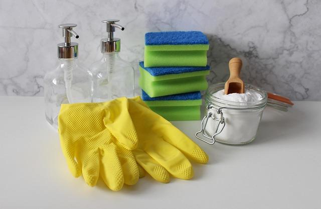 Cleaning supplies and gloves laid out before a house cleaning visit in Ottawa