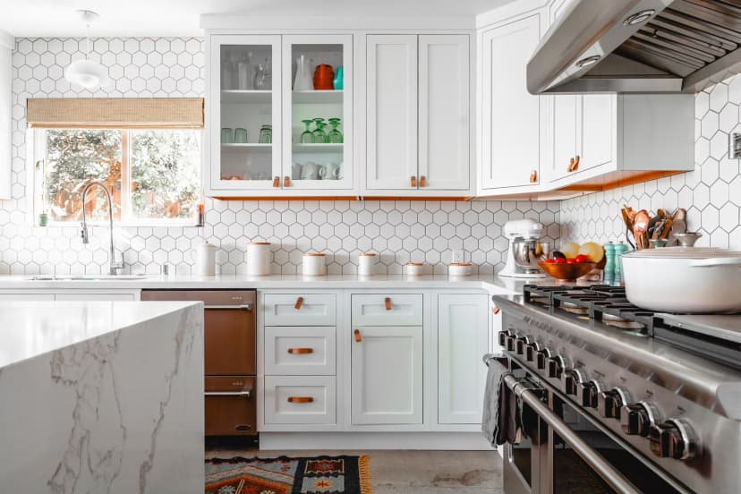 a white and silver colored kitchen and oven