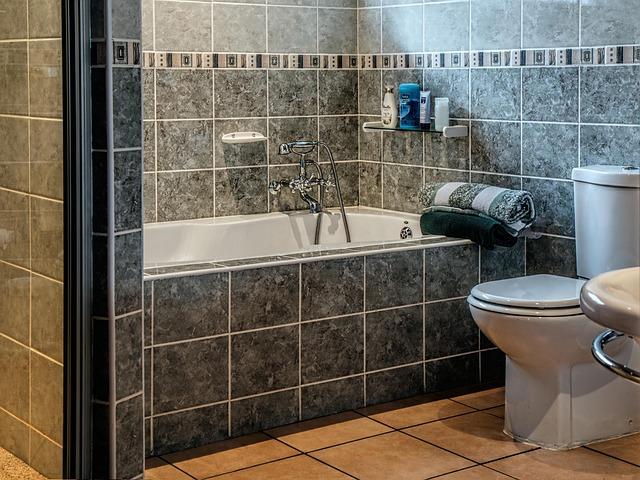 Freshly cleaned bathroom with a spotless tub, tile, and toilet