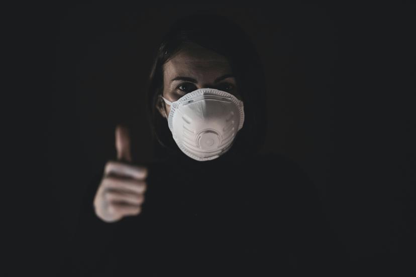a woman wearing a mask when dealing with dangerous home cleaning chemicals