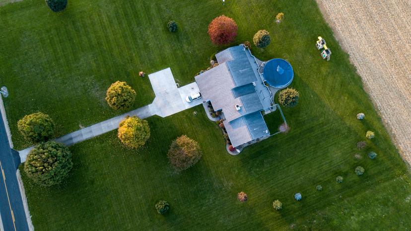 top view of a home with green healthy lawn